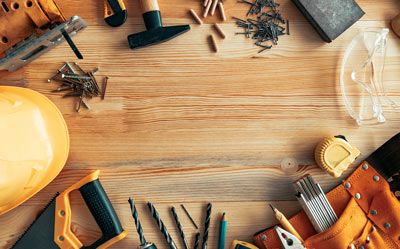 tools and equipment arranged on wooden surface for construction projects and DIY tasks two essential tools